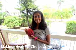 Nadia holding Cacao Pod